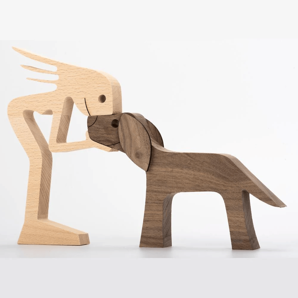 A Woman And Black Floppy Ears Dog Wood Sculpture