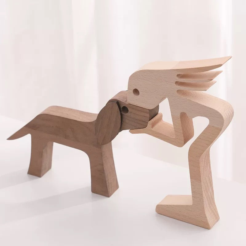 A Woman And Black Floppy Ears Dog Wood Sculpture